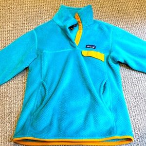 Turquoise blue Patagonia women’s size small fleece jacket.